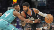 Mar 31, 2024; Charlotte, North Carolina, USA; LA Clippers forward Paul George (13) drives to the basket against Charlotte Hornets forward Brandon Miller (24) during the second half at Spectrum Center. Mandatory Credit: Jim Dedmon-USA TODAY Sports