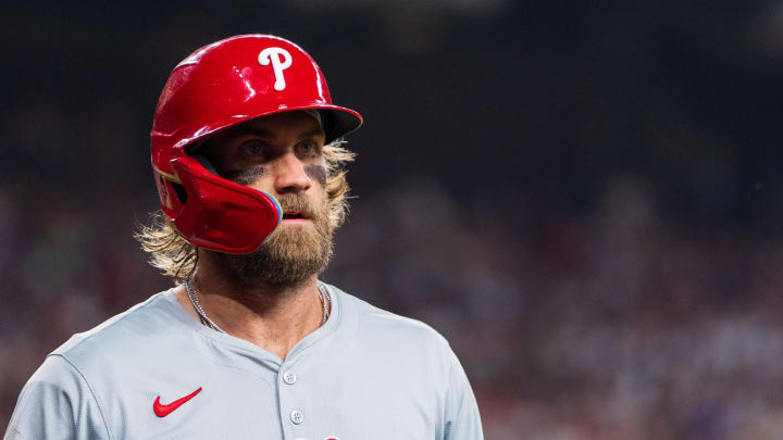 Aug 10, 2024; Phoenix, Arizona, USA;  Philadelphia Phillies infielder Bryce Harper reacts after getting stranded at first base.