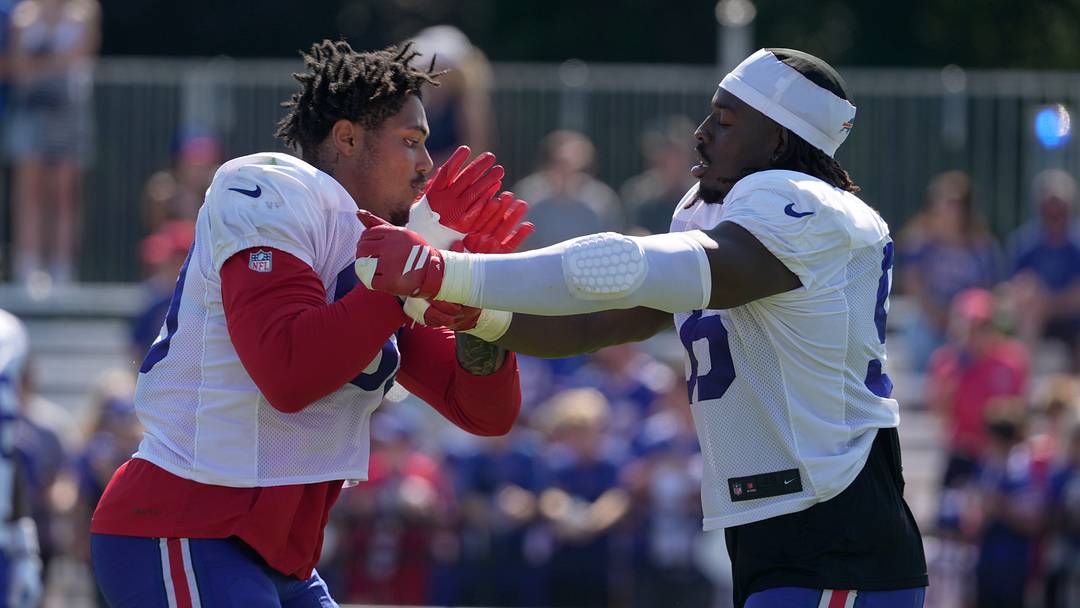 The Buffalo Bills' T.J. Parker gets a few extra drills in after practice with Javon Solomon at Bills Training Camp at St. John Fisher University in Pittsford on Aug. 4, 2026.