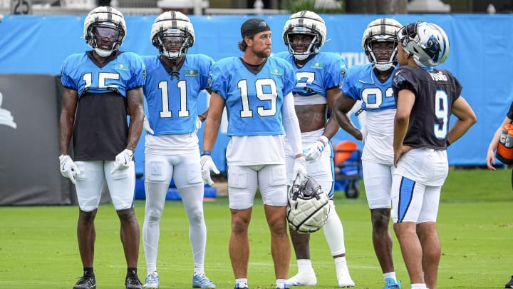 Jul 30, 2024; Charlotte, NC, USA; Carolina Panthers wide receiver Jonathan Mingo (15), wide receiver Ihmir Smith-Marsette (11), wide receiver Adam Thielen (19), wide receiver Deven Thompkins (12), wide receiver David Moore (83) and quarterback Bryce Young (9) during training camp at Carolina Panthers Practice Fields. Mandatory Credit: Jim Dedmon-USA TODAY Sports