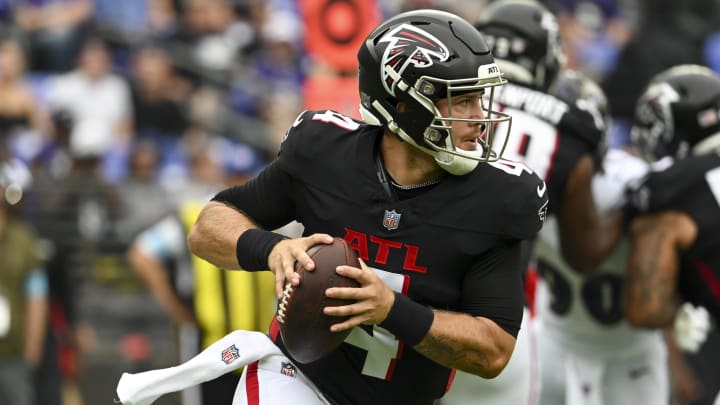 Falcons quarterback Taylor Heinicke rolls out to pass during the first half against the Baltimore Ravens at M&T Bank Stadium.