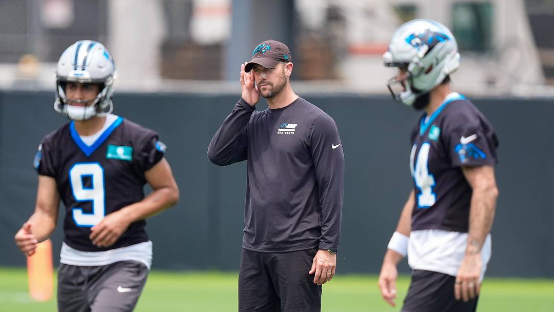 Carolina Panthers head coach Dave Canales with his quarterbacks Bryce Young and Will Grier 