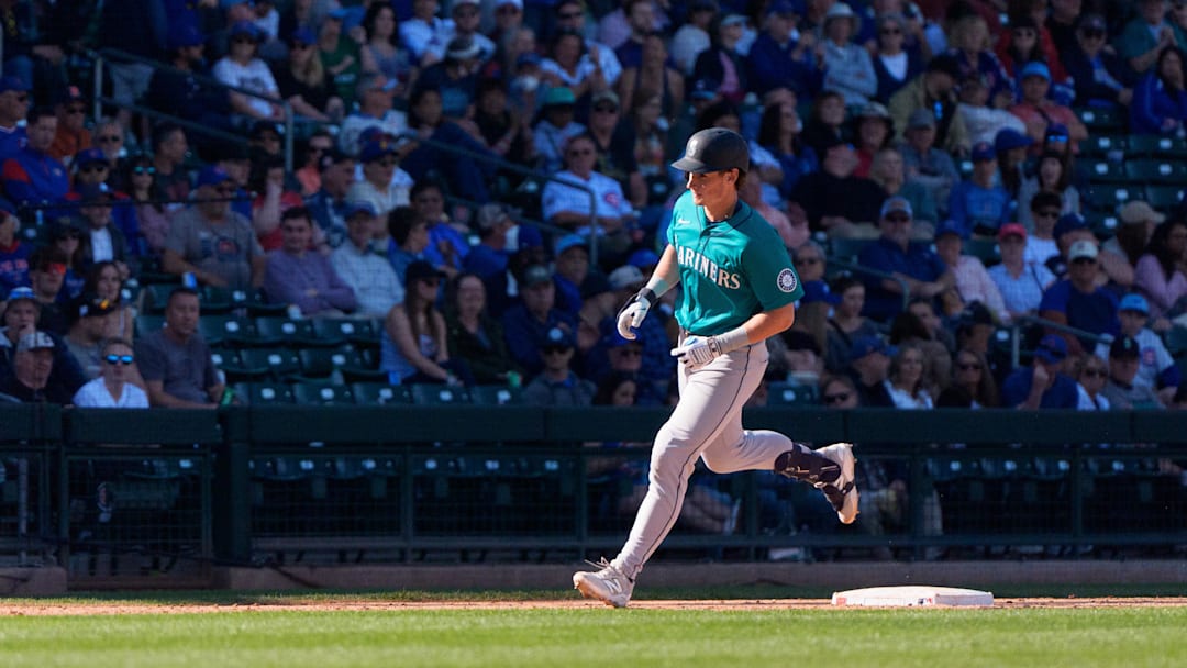 Mar 8, 2025; Mesa, Arizona, USA; Seattle Mariners infielder Colt Emerson (85) hits a home run in the top of the ninth during a spring training game against the Chicago Cubs at Sloan Park. Mandatory Credit: Allan Henry-Imagn Images