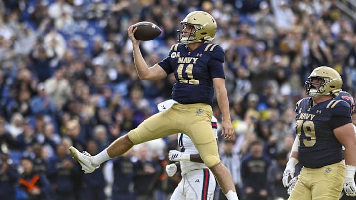 The status of Navy quarterback Blake Horvath, shown here celebrating a touchdown against Florida Atlantic, is uncertain for Saturday's game against USF. He missed last week's game at Notre Dame with an upper-body injury.