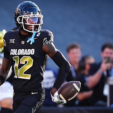 Aug 29, 2024; Boulder, Colorado, USA; Colorado Buffaloes wide receiver Travis Hunter (12) reacts after scoring a touchdown in the first half against the North Dakota State Bison at Folsom Field.