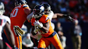 Denver Broncos running back Javonte Williams carries the ball in the first quarter against the Atlanta Falcons.