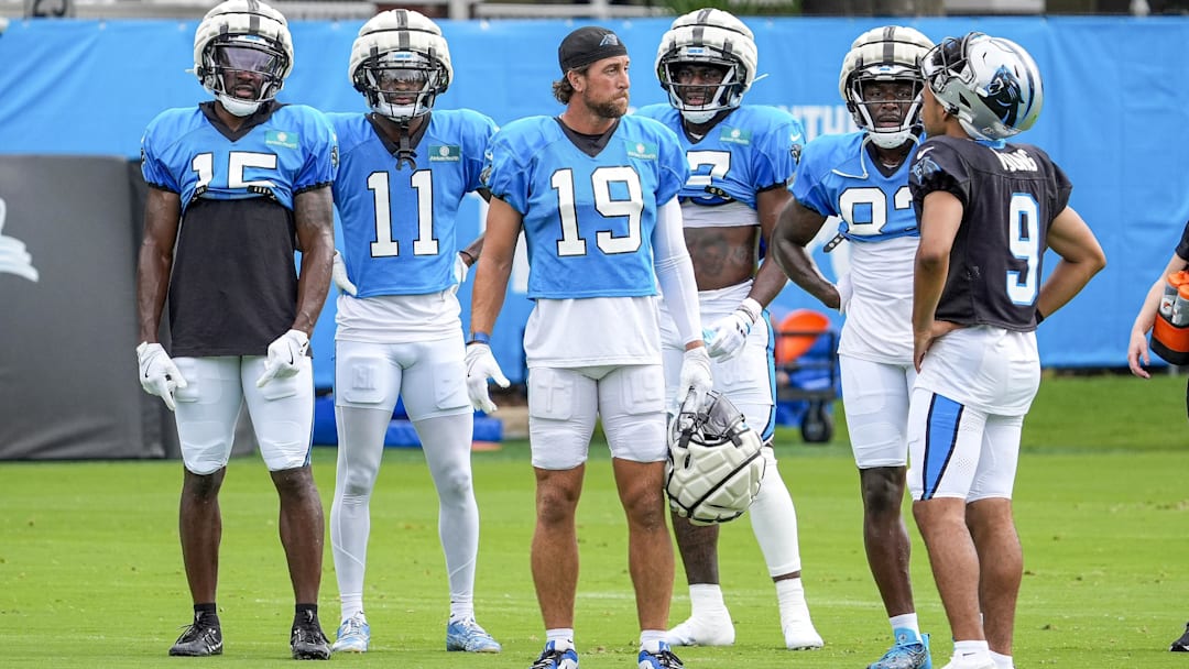 Carolina Panthers wide receiver Adam Thielen and quarterback Bryce Young during training camp.