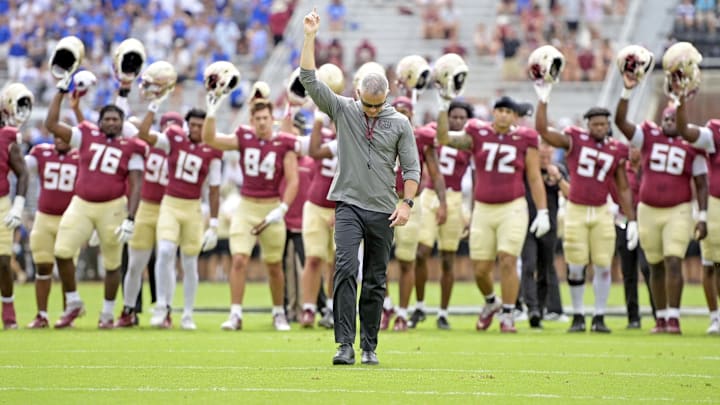 Sep 14, 2024; Tallahassee, Florida, USA; Florida State Seminoles head coach Mike Norvell leads his team before a game against the Memphis Tigers at Doak S. Campbell Stadium. Mandatory Credit: Melina Myers-Imagn Images