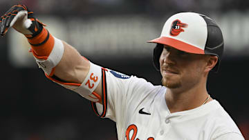 Jul 30, 2024; Baltimore, Maryland, USA;  Baltimore Orioles first base Ryan O'Hearn (32) reacts after hitting a two run single against the Toronto Blue Jays in the third inning at Oriole Park at Camden Yards. Mandatory Credit: Tommy Gilligan-Imagn Images