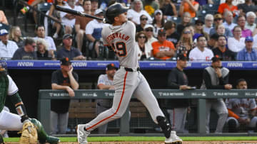 Jul 20, 2024; Denver, Colorado, USA; San Francisco Giants outfielder Tyler Fitzgerald (49) hits a home run against the Colorado Rockies in the third inning at Coors Field