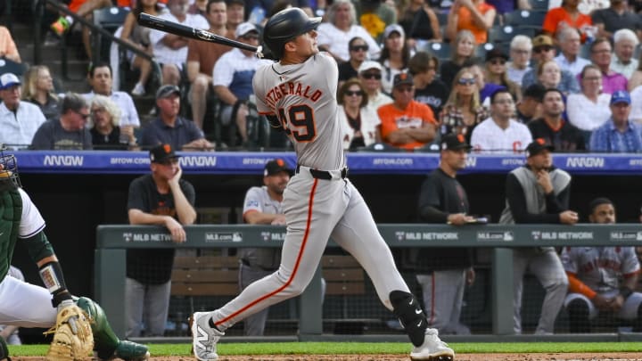 Jul 20, 2024; Denver, Colorado, USA; San Francisco Giants outfielder Tyler Fitzgerald (49) hits a home run against the Colorado Rockies in the third inning at Coors Field