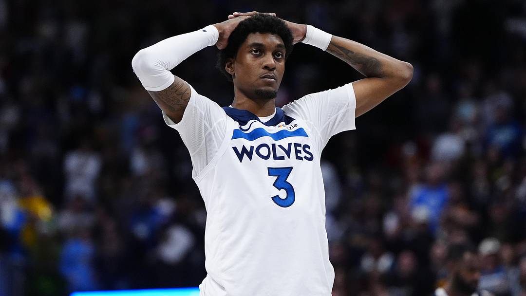 Dec 25, 2025; Denver, Colorado, USA; Minnesota Timberwolves forward Jaden McDaniels (3) reacts to a flagrant foul called in overtime against the Denver Nuggets at Ball Arena. Mandatory Credit: Ron Chenoy-Imagn Images