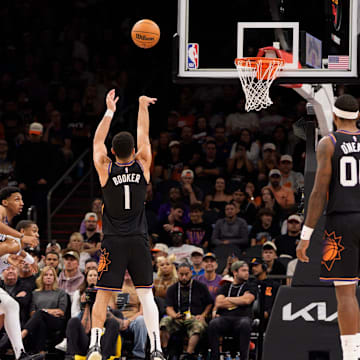 Nov 2, 2025; Phoenix, Arizona, USA; Phoenix Suns guard Devin Booker (1) shoots a free throw during the second half against the San Antonio Spurs at Mortgage Matchup Center. Mandatory Credit: Allan Henry-Imagn Images