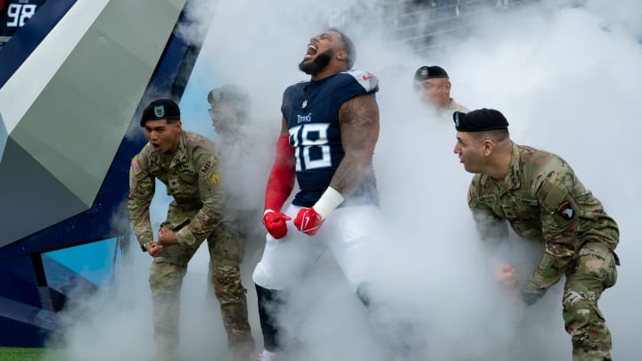 Tennessee Titans defensive tackle Jeffery Simmons (98) makes his entrance with service members from Fort Campbell before their game at Nissan Stadium in Nashville, Tenn., Sunday, Nov. 26, 2023.