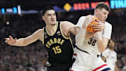 Purdue Boilermakers center Zach Edey (15) reaches in on Connecticut Huskies center Donovan Clingan (32) during the Men's NCAA national championship game at State Farm Stadium in Glendale on April 8, 2024.