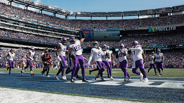 Sep 8, 2024; East Rutherford, New Jersey, USA; Minnesota Vikings safety Harrison Smith (22) celebrates his interception with teammates during the second half against the New York Giants at MetLife Stadium. Mandatory Credit: Vincent Carchietta-Imagn Images