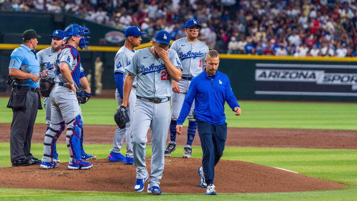 Aug 30, 2024; Phoenix, Arizona, USA;  Los Angeles Dodgers pitcher Clayton Kershaw (22) reacts after pitching change in the second inning during a game against the Arizona Diamondbacks at Chase Field. Mandatory Credit: Allan Henry-USA TODAY Sports