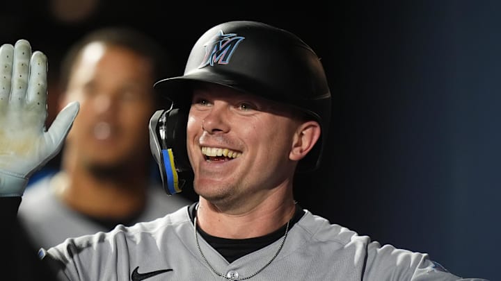 Miami Marlins right fielder Troy Johnston (75) celebrates scoring a run in the fourth inning against the Colorado Rockies at Coors Field. Miami Marlins right fielder Troy Johnston (75) celebrates scoring a run in the fourth inning against the Colorado Rockies at Coors Field.
