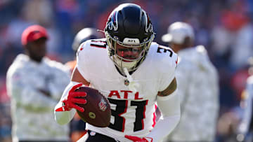 Nov 17, 2024; Denver, Colorado, USA; Atlanta Falcons safety Justin Simmons (31) warms up before the game against the Denver Broncos at Empower Field at Mile High. Mandatory Credit: Ron Chenoy-Imagn Images