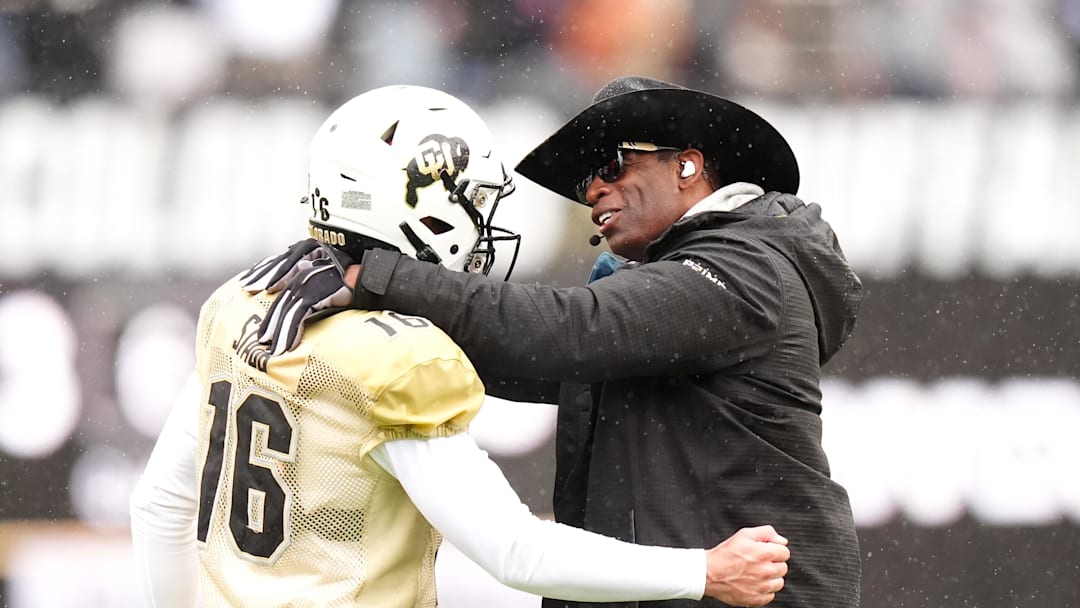Apr 27, 2024; Boulder, CO, USA; Colorado Buffaloes head coach Deion Sanders talks to quarterback Ryan Staub (16) during a spring game event at Folsom Field. Mandatory Credit: Ron Chenoy-Imagn Images