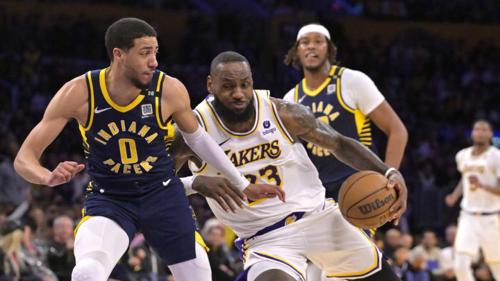 Mar 24, 2024; Los Angeles, California, USA;   Los Angeles Lakers forward LeBron James (23) drives past Indiana Pacers guard Tyrese Haliburton (0) in the second half at Crypto.com Arena. Mandatory Credit: Jayne Kamin-Oncea-USA TODAY Sports