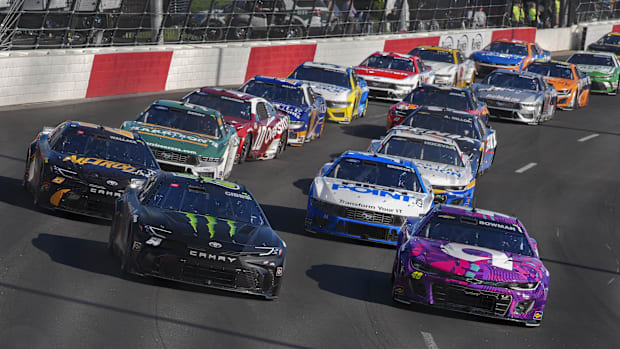 Ty Gibbs (54) and Alex Bowman (48) lead the field on a restart during the All Star Open race at North Wilkesboro Speedway.