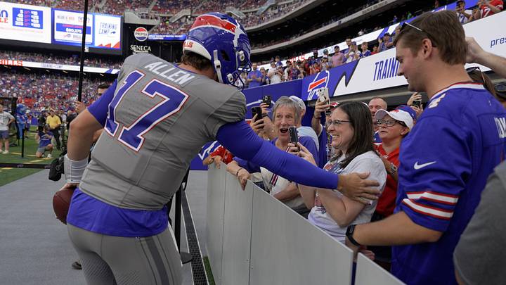 Top 5 Players Generating Buzz at NFL Training Camps and Their Card Markets (featured). Photo by ON SI Collectibles
