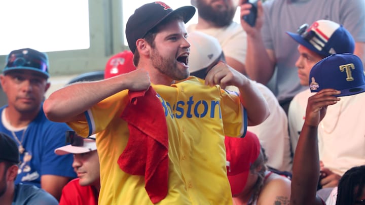 A Boston Red Sox fan reacts during the first round of the MLB Draft at Cowtown Coliseum.