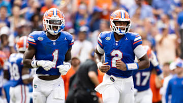 Sep 14, 2024; Gainesville, Florida, USA; Florida Gators quarterback DJ Lagway (2) and running back Montrell Johnson Jr. (1) run onto the field against the Texas A&M Aggies during the first half at Ben Hill Griffin Stadium. Mandatory Credit: Matt Pendleton-Imagn Images