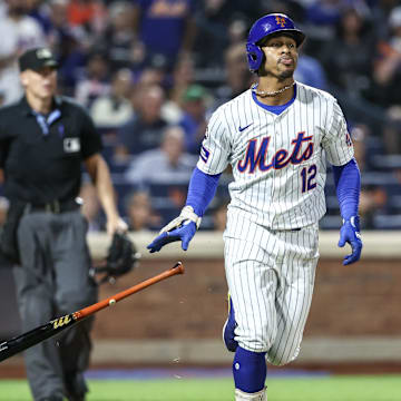 Sep 3, 2024; New York City, New York, USA;  New York Mets shortstop Francisco Lindor (12) hits a two-run home run in the third inning against the Boston Red Sox at Citi Field. Mandatory Credit: Wendell Cruz-Imagn Images