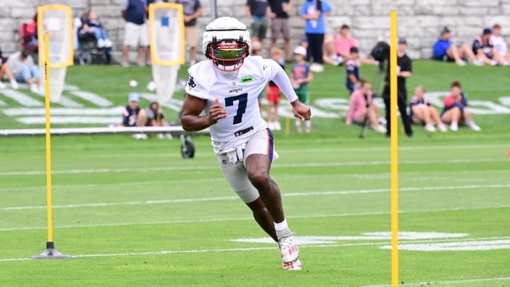 Jul 24, 2024; Foxborough, MA, USA;  New England Patriots wide receiver JuJu Smith-Schuster (7) runs through a drill during training camp at Gillette Stadium. Mandatory Credit: Eric Canha-USA TODAY Sports