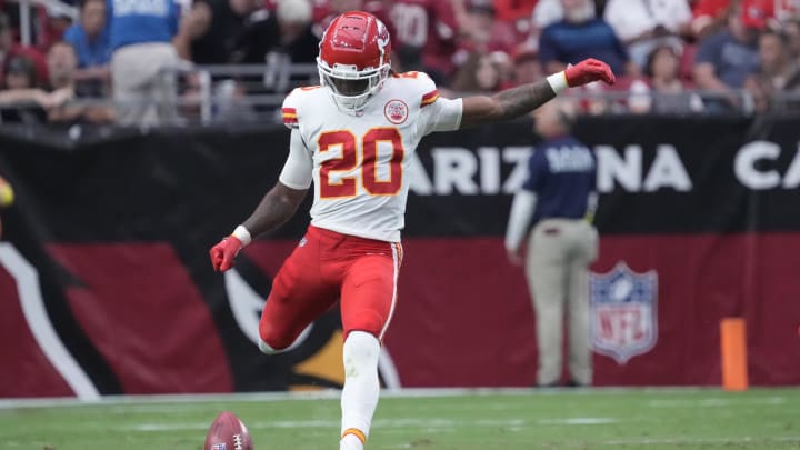 Sep 11, 2022; Glendale, Arizona, United States;  Kansas City Chiefs safety Justin Reid (20) kicks off against the Arizona Cardinals during the third quarter at State Farm Stadium. Mandatory Credit: Michael Chow-USA TODAY Sports