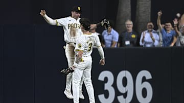 Aug 12, 2024; San Diego, California, USA; San Diego Padres center fielder Jackson Merrill (3) celebrates on the field with right fielder Bryce Johnson (27) after defeating the Pittsburgh Pirates at Petco Park. Mandatory Credit: Orlando Ramirez-USA TODAY Sports