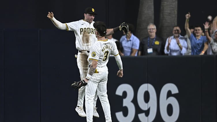 Aug 12, 2024; San Diego, California, USA; San Diego Padres center fielder Jackson Merrill (3) celebrates on the field with right fielder Bryce Johnson (27) after defeating the Pittsburgh Pirates at Petco Park. Mandatory Credit: Orlando Ramirez-USA TODAY Sports