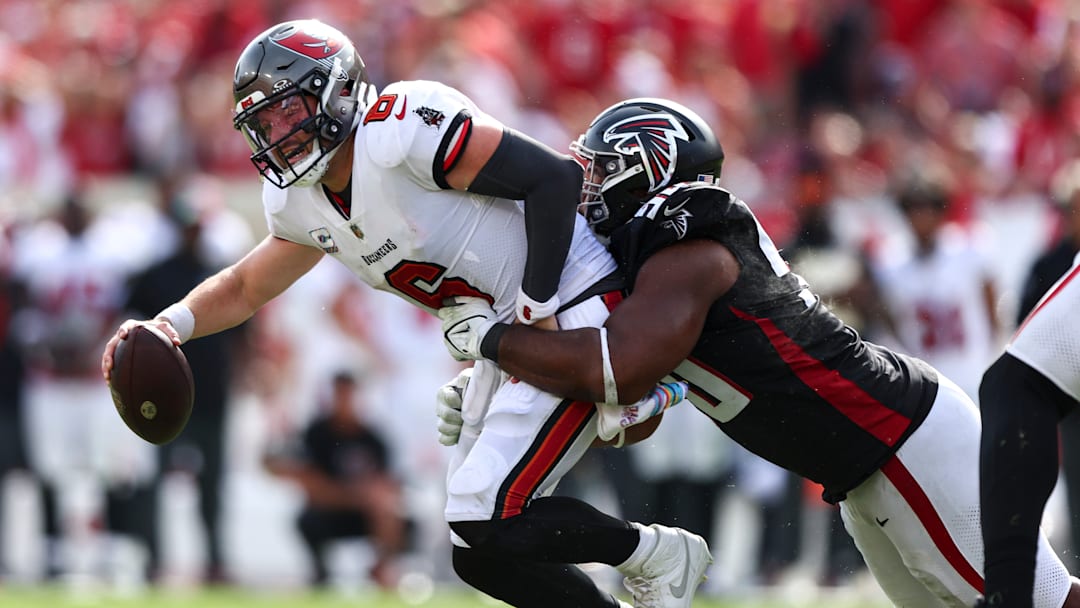 Tampa Bay Buccaneers QB Baker Mayfield getting sacked by an Atlanta Falcons defender. 