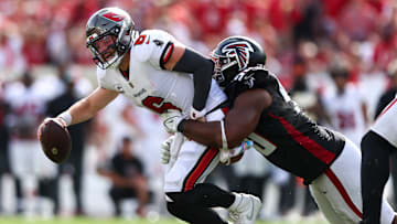 Tampa Bay Buccaneers QB Baker Mayfield getting sacked by an Atlanta Falcons defender. 