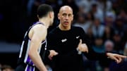 Mar 17, 2025; Sacramento, California, USA; Sacramento Kings interim head coach Doug Christie  talks with guard Zach LaVine (8) during the fourth quarter against the Memphis Grizzlies at Golden 1 Center. Mandatory Credit: Sergio Estrada-Imagn Images