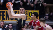 Feb 10, 2024; West Lafayette, Indiana, USA; Purdue Boilermakers center Zach Edey (15) holds the ball while Indiana Hoosiers center Kel'el Ware (1) defends in the first half at Mackey Arena. Mandatory Credit: Trevor Ruszkowski-USA TODAY Sports