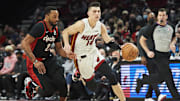 Jan 5, 2022; Portland, Oregon, USA;Miami Heat guard Tyler Herro (14) drives to the basket during the first half against Portland Trail Blazers forward Norman Powell (24) at Moda Center. Mandatory Credit: Troy Wayrynen-Imagn Images