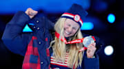 Feb 20, 2022; Beijing, CHINA; Jessie Diggins (USA) celebrates her silver medal in cross-country skiing women's 30km mass start during the closing ceremony for the Beijing 2022 Olympic Winter Games at Beijing National Stadium. Mandatory Credit: Rob Schumacher-Imagn Images