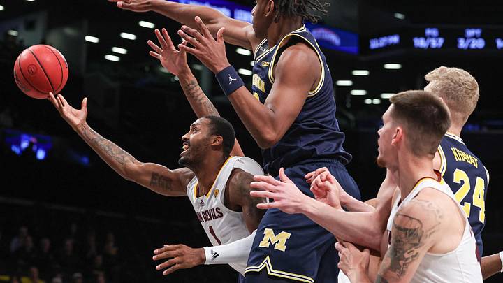 Nov 17, 2022; Brooklyn, New York, USA; Arizona State Sun Devils guard Luther Muhammad (1) drives to the basket as Michigan Wolverines forward Tarris Reed Jr. (32) defends during the second half at Barclays Center. Mandatory Credit: Vincent Carchietta-Imagn Images
