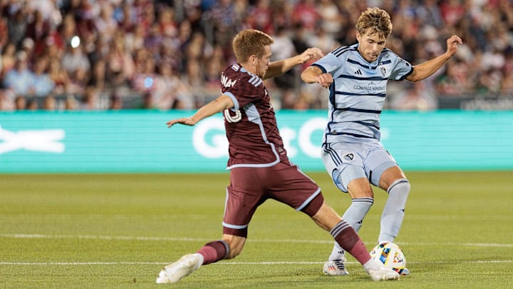 Sporting Kansas City midfielder Jake Davis (17) controls the ball against Colorado Rapids midfielder Connor Ronan (20) during the second half at Dick's Sporting Goods Park 