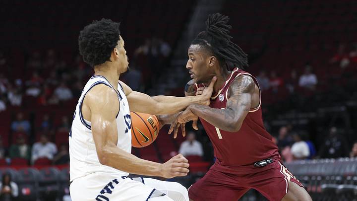 Nov 9, 2024; Houston, Texas, USA; Florida State Seminoles guard Jamir Watkins (1) controls the ball as Rice Owls guard Trae Broadnax (12) defends during the first half at Toyota Center. Mandatory Credit: Troy Taormina-Imagn Images