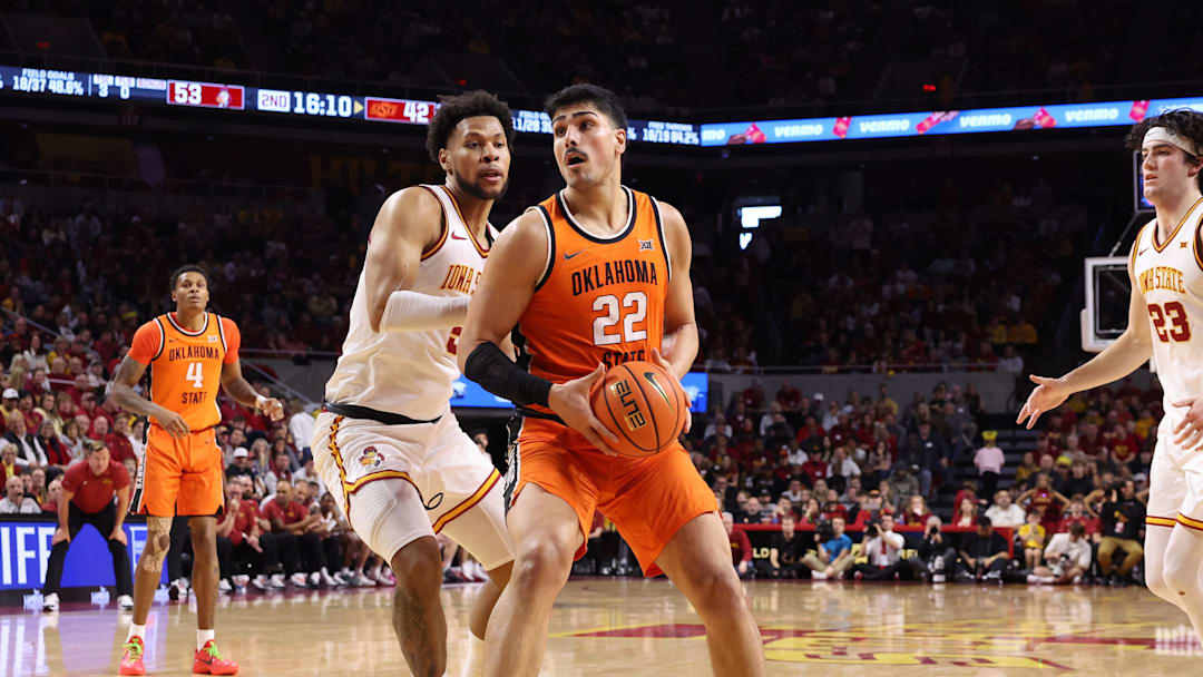 Jan 10, 2026; Ames, Iowa, USA; Iowa State Cyclones forward Joshua Jefferson (5) defends Oklahoma State Cowboys center Parsa Fallah (22) during the second half at James H. Hilton Coliseum. Mandatory Credit: Reese Strickland-Imagn Images