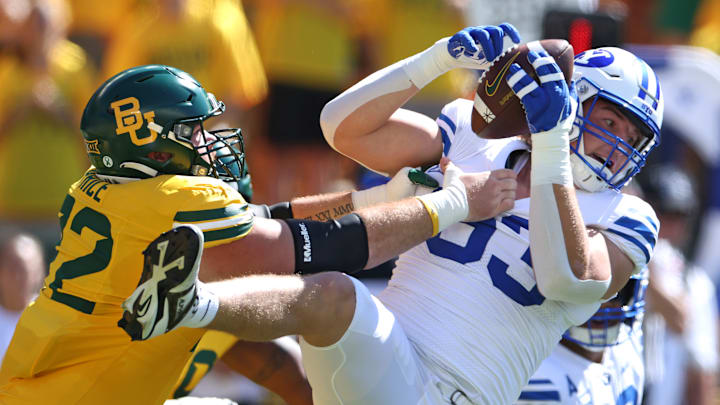 Blake Mangelson hauls in an interception against Baylor.