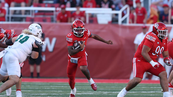 Sep 6, 2025; Salt Lake City, Utah, USA; Utah Utes quarterback Byrd Ficklin (15) runs the ball against the Cal Poly Mustangs during the second half at Rice-Eccles Stadium. Mandatory Credit: Rob Gray-Imagn Images