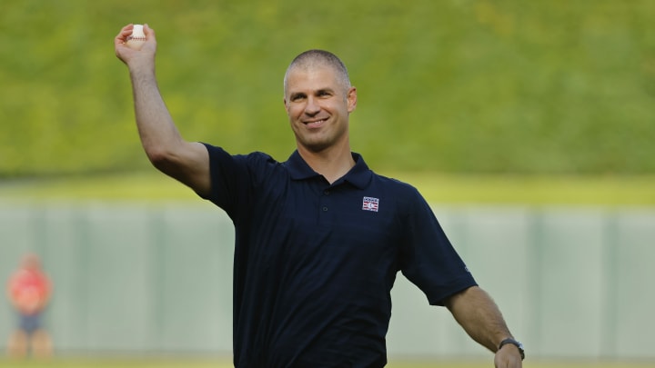 Minnesota Twins former player Joe Mauer throws a ceremonial pitch as the team honors his recent induction into the Baseball Hall of Fame before a game against the Chicago White Sox at Target Field in Minneapolis on Aug. 3, 2024. 