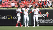 Jun 30, 2024; St. Louis, Missouri, USA; St. Louis Cardinals outfielder Brendan Donovan (33), outfielder Michael Siani (63), and outfielder Dylan Carlson (3) celebrate after defeating the Cincinnati Reds at Busch Stadium. Mandatory Credit: Jeff Le-USA TODAY Sports