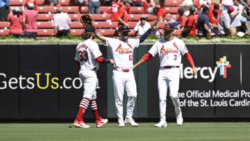Jun 30, 2024; St. Louis, Missouri, USA; St. Louis Cardinals outfielder Brendan Donovan (33), outfielder Michael Siani (63), and outfielder Dylan Carlson (3) celebrate after defeating the Cincinnati Reds at Busch Stadium. Mandatory Credit: Jeff Le-USA TODAY Sports