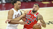 Jaylon Tyson defends Chicago Bulls guard Chris Duarte.